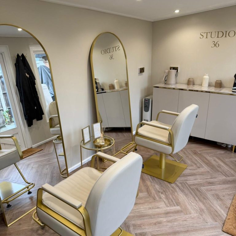 Hair Washing A person receives a hair wash at a salon, with water flowing and a stylist's hands visible.
